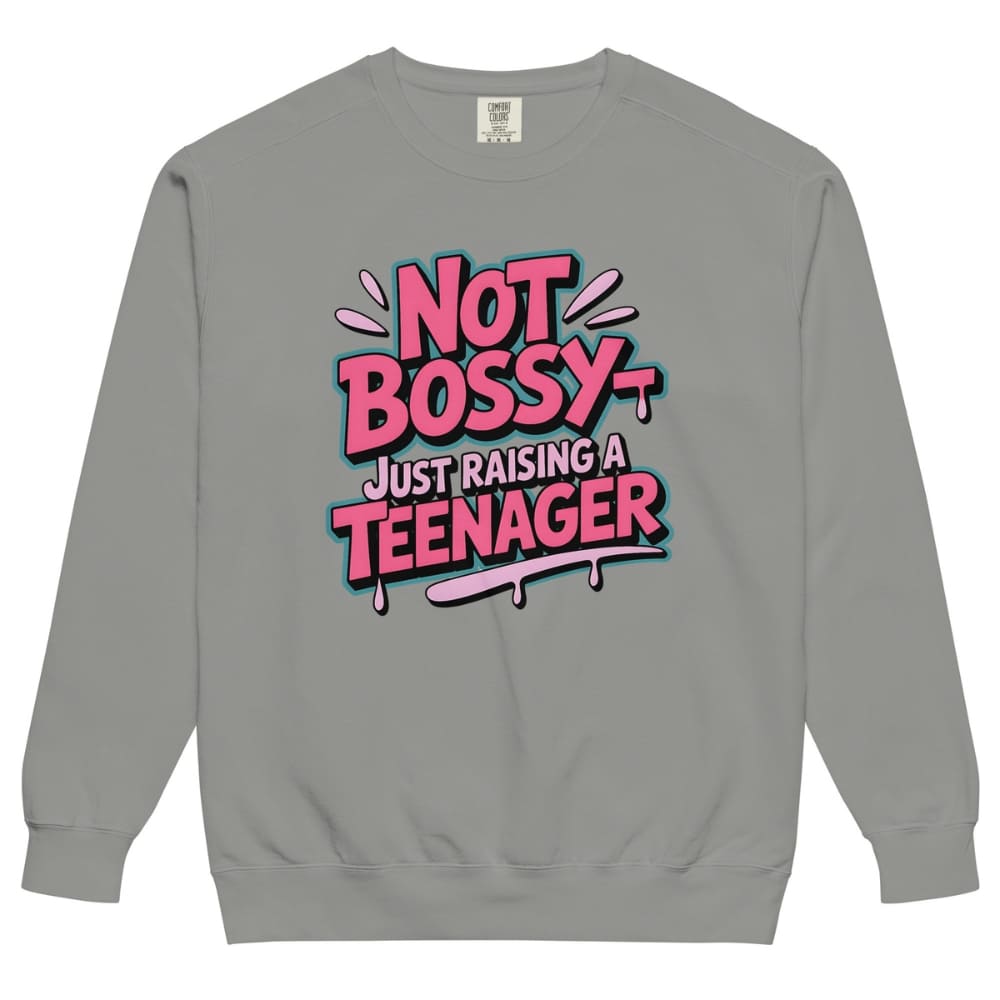 Gray sweatshirt with colorful text 'Not Bossy Just Raising a Teenager' on a white background