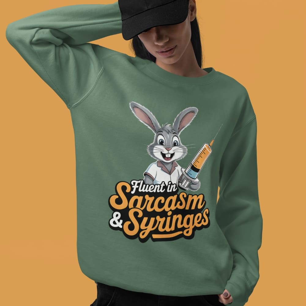Person wearing a green sweatshirt with a cartoon rabbit design and text on an orange background