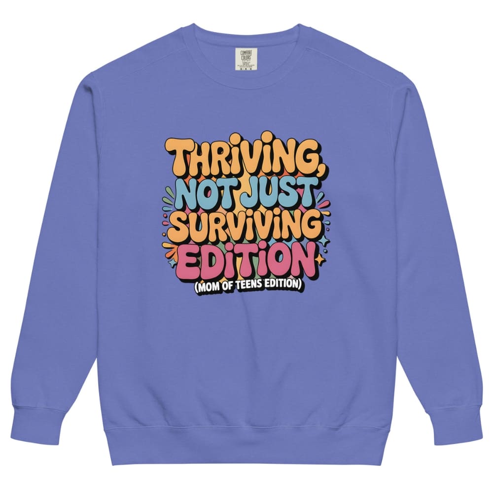 Blue sweatshirt with colorful text design on a white background