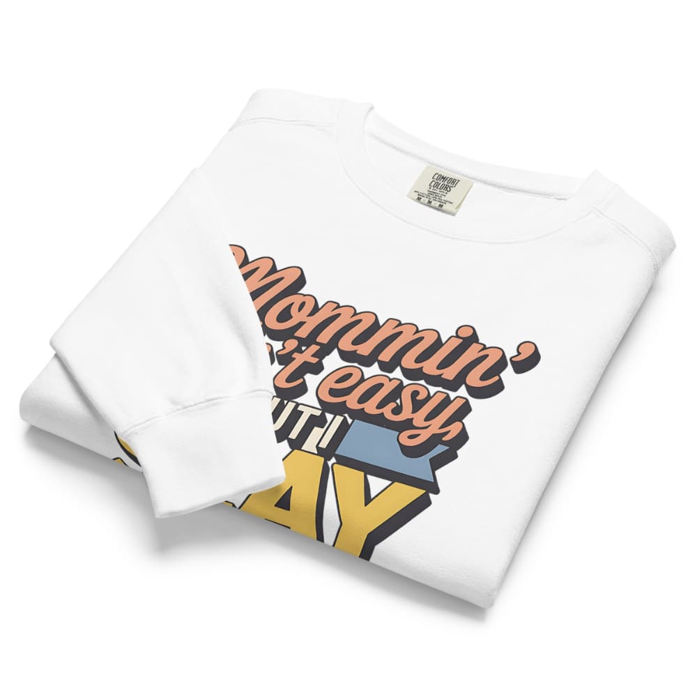 “Mommin' Ain’t Easy But I Slay” retro-style DTG printed design in peach, blue, and yellow on vintage garment-dyed fleece sweatshirt