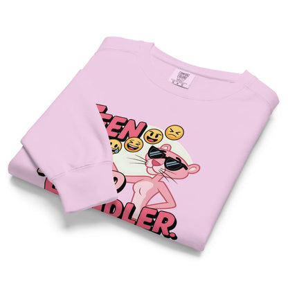 Folded pink sweatshirt with cartoon character and text on a white background