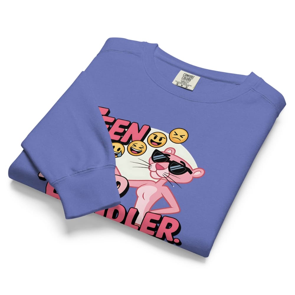 Folded blue sweatshirt with a graphic design of a pink panther and text on a white background