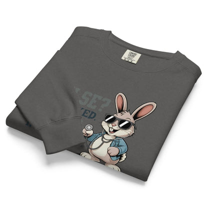 Folded gray sweatshirt with a cartoon rabbit design on a white background