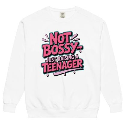 White sweatshirt with colorful text 'Not Bossy Just Raising a Teenager' on a white background
