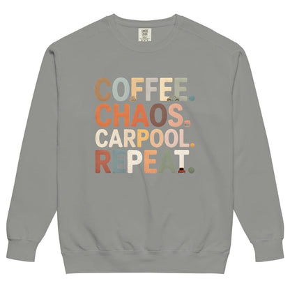 Gray sweatshirt with colorful text 'COFFEE. CHAOS. CARPOOL. REPEAT.' on a white background