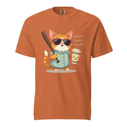 Cool cat with sunglasses holding a softball bat and coffee cup, beside text “Fueled by Coffee & Curveballs” – printed on soft heavyweight t-shirt for sporty moms