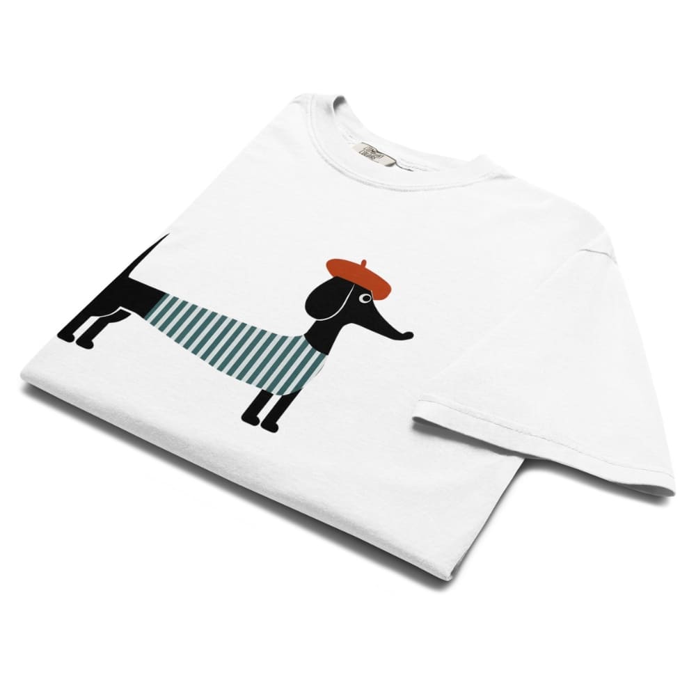 White t-shirt with a dachshund graphic wearing a striped sweater and red beret on a white background
