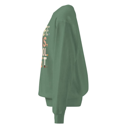 Green sweatshirt with text on the sleeve against a white background
