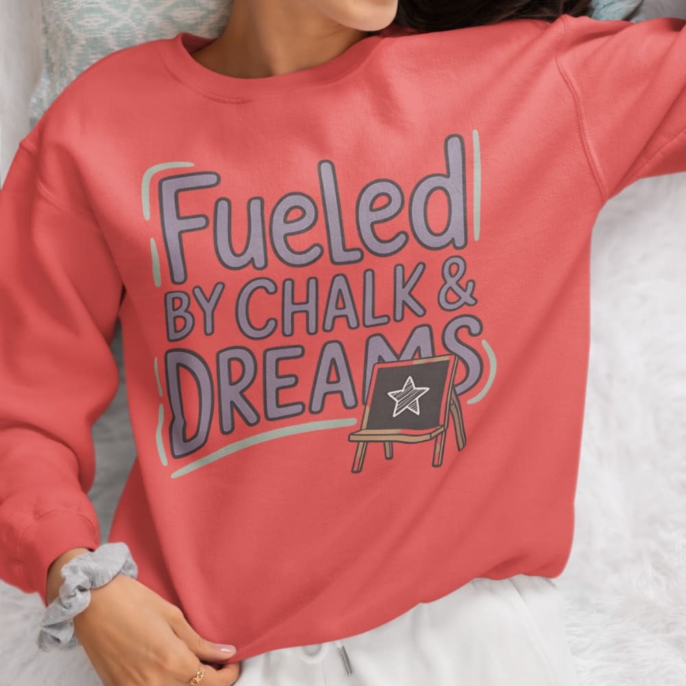 Fueled by Chalk & Dreams printed design on a vintage-style garment-dyed sweatshirt with chalkboard illustration – soft fleece ideal for teachers