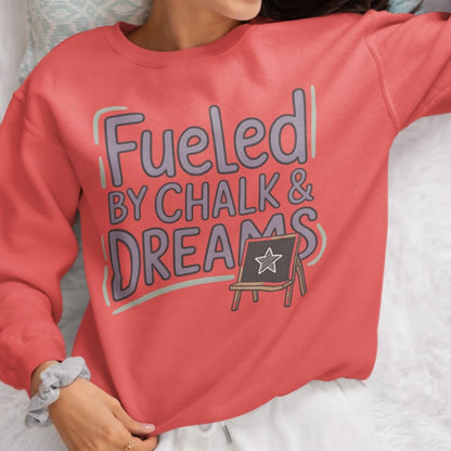 Fueled by Chalk & Dreams printed design on a vintage-style garment-dyed sweatshirt with chalkboard illustration – soft fleece ideal for teachers