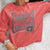 Fueled by Chalk & Dreams printed design on a vintage-style garment-dyed sweatshirt with chalkboard illustration – soft fleece ideal for teachers