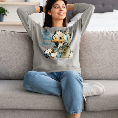 Person wearing a hoodie with a cartoon character design, sitting on a couch.