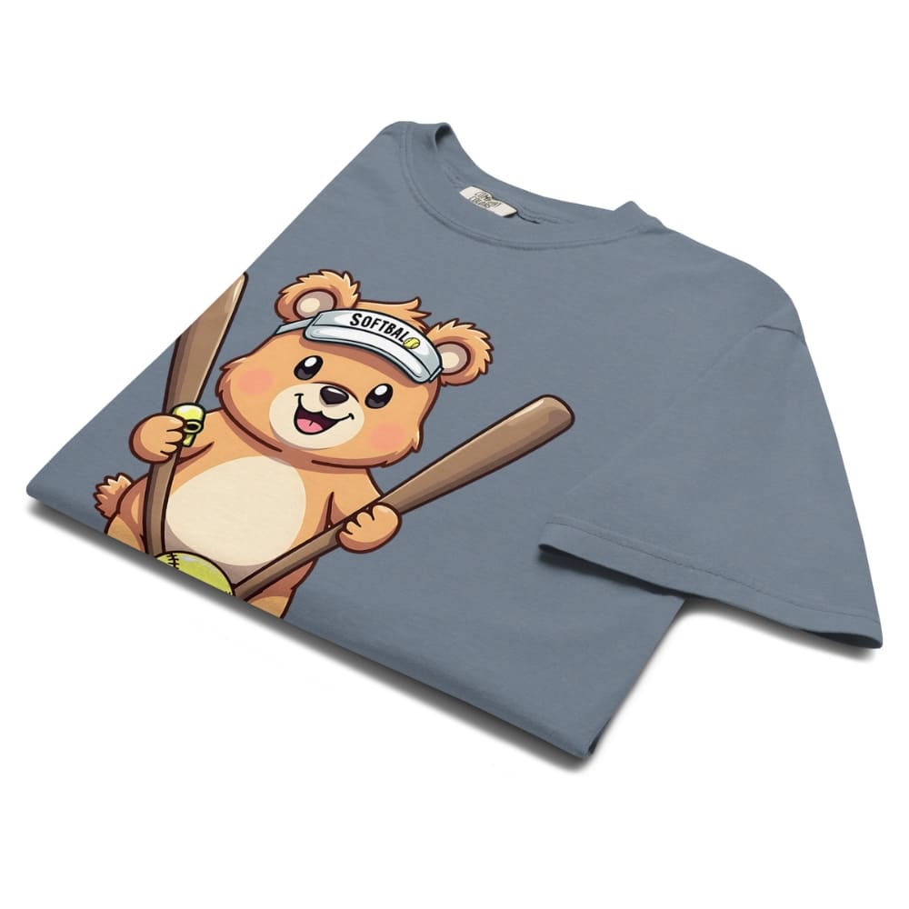 Cartoon bear holding softball bats and ball wearing a visor labeled “Softball” – printed on garment-dyed heavyweight t-shirt for sporty moms