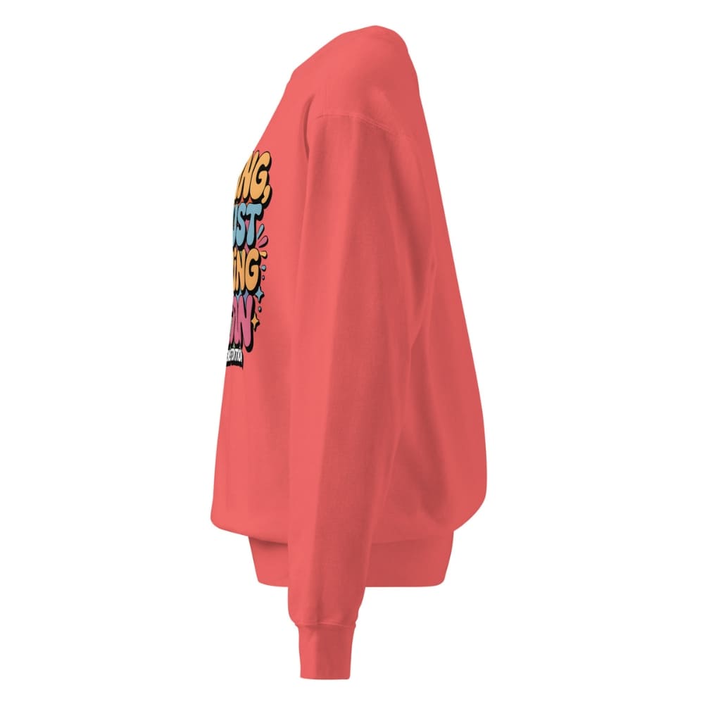Red sweatshirt with colorful text design on a white background