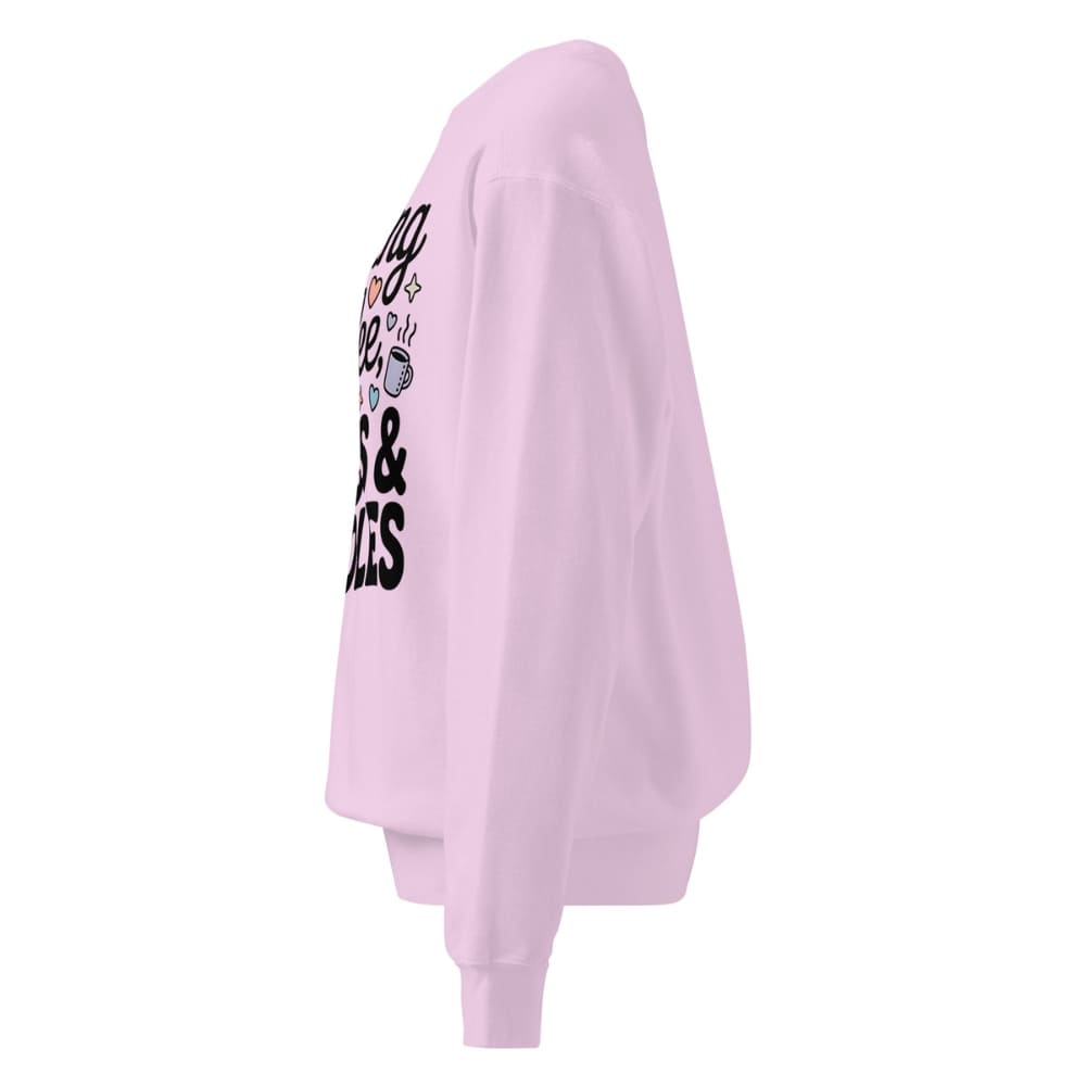 Light pink sweatshirt with text on the sleeve against a white background