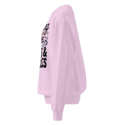 Light pink sweatshirt with text on the sleeve against a white background