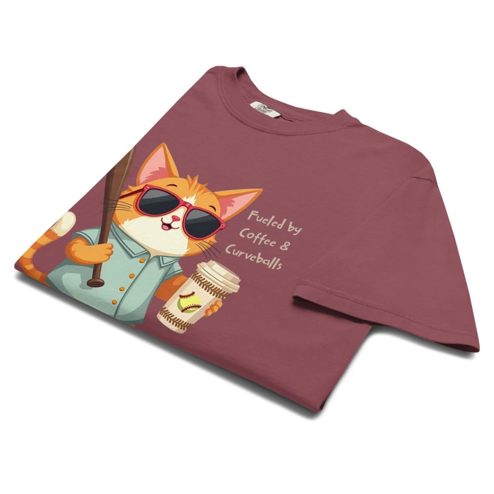 Cool cat with sunglasses holding a softball bat and coffee cup, beside text “Fueled by Coffee & Curveballs” – printed on soft heavyweight t-shirt for sporty moms