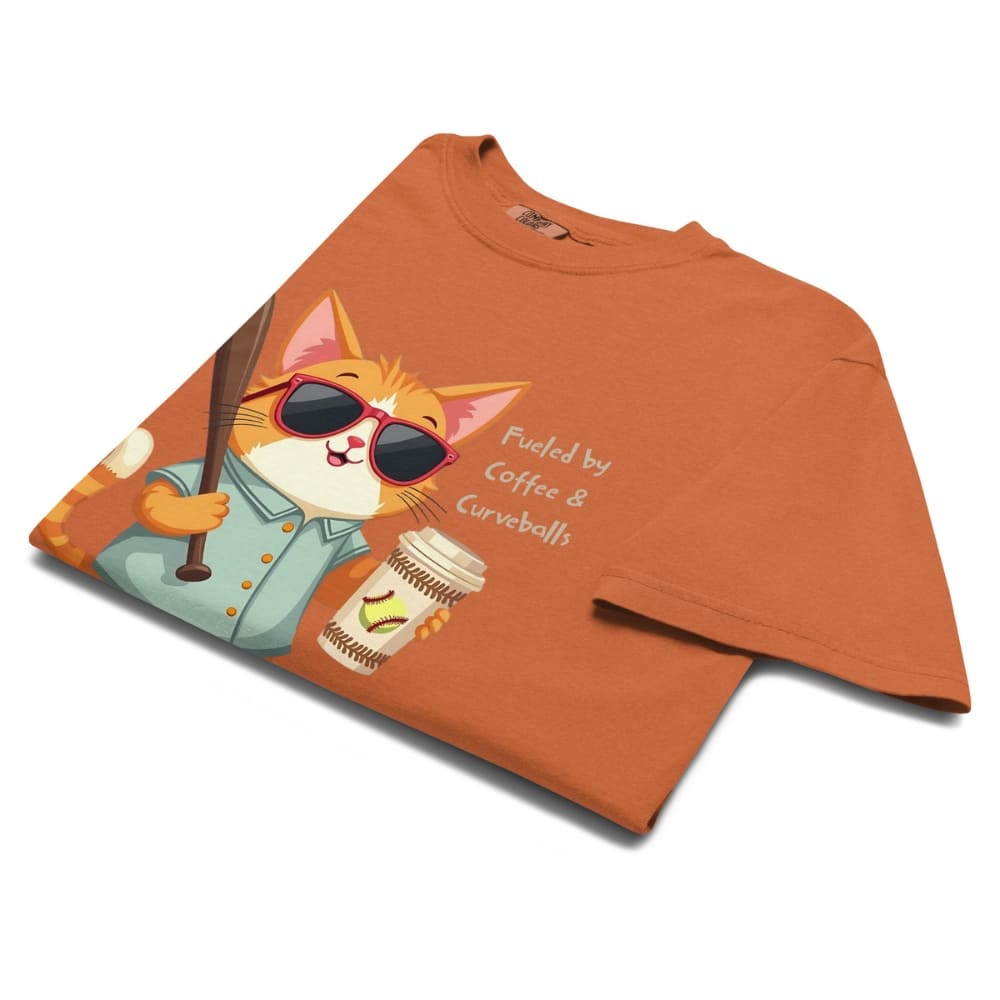 Cool cat with sunglasses holding a softball bat and coffee cup, beside text “Fueled by Coffee & Curveballs” – printed on soft heavyweight t-shirt for sporty moms