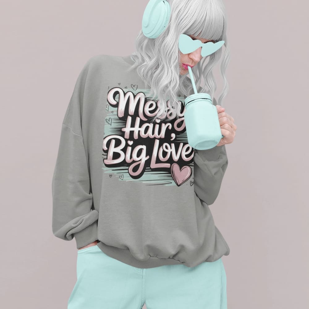 Pastel brushstroke design with “Messy Hair, Big Love” printed text on a vintage garment-dyed sweatshirt – cozy fleece for moms and creators