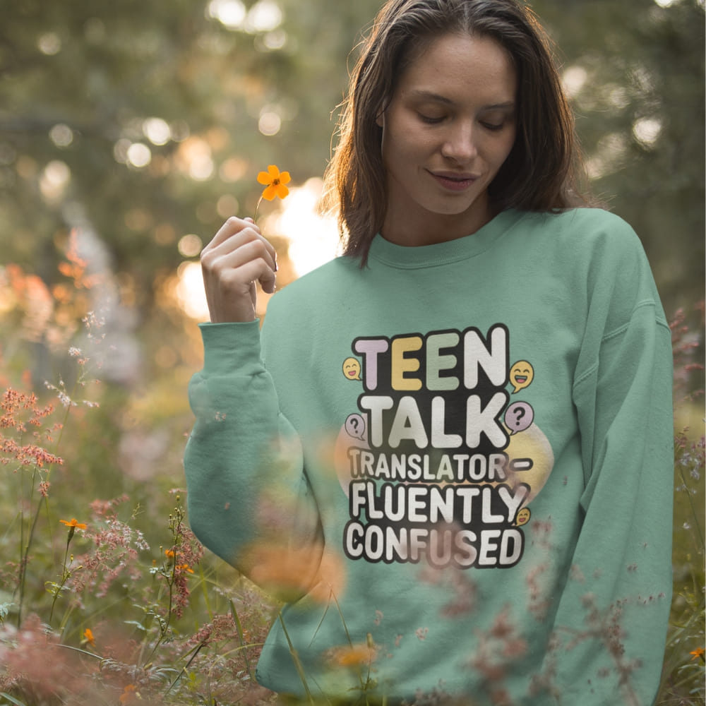 Woman wearing a green sweatshirt with text in a field