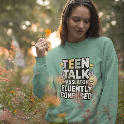 Woman wearing a green sweatshirt with text in a field