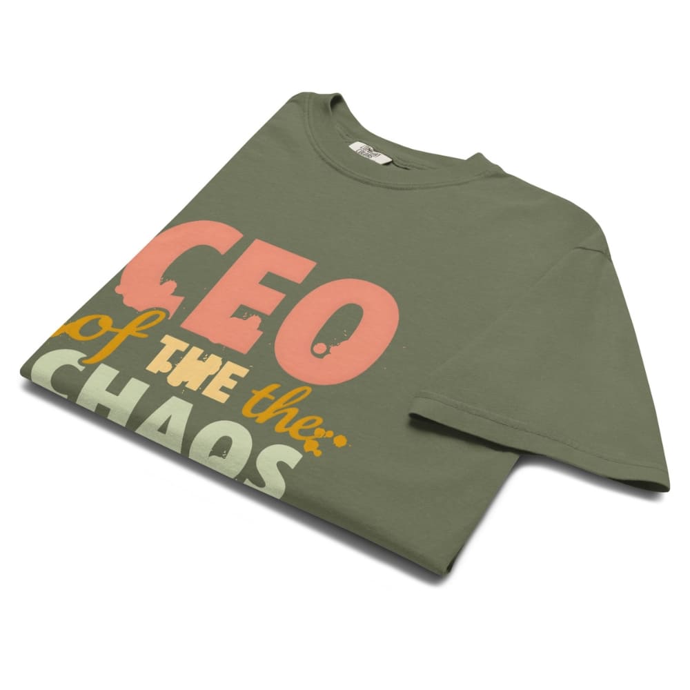 CEO of the Chaos” printed on a heavyweight cotton t-shirt in soft pastel ink, laid flat with a minimal lifestyle background.