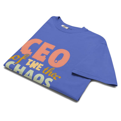 CEO of the Chaos” printed on a heavyweight cotton t-shirt in soft pastel ink, laid flat with a minimal lifestyle background.