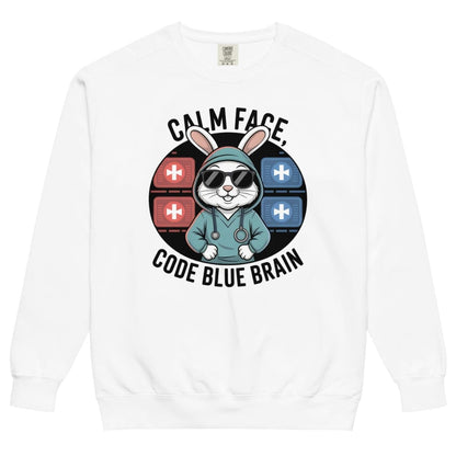 White sweatshirt with a graphic design featuring a rabbit in a medical outfit and text 'Calm Face, Code Blue Brain' on a white background.