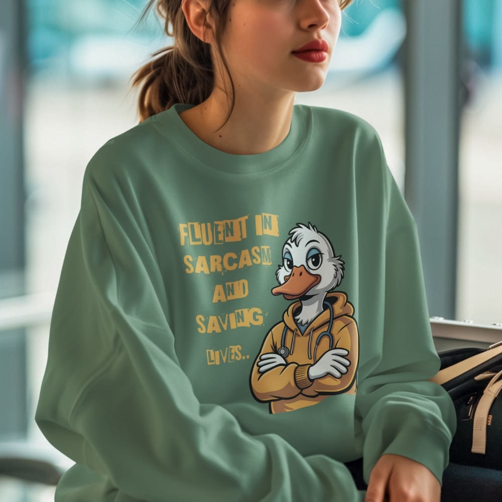 Person wearing a green sweatshirt with a cartoon duck character and text.