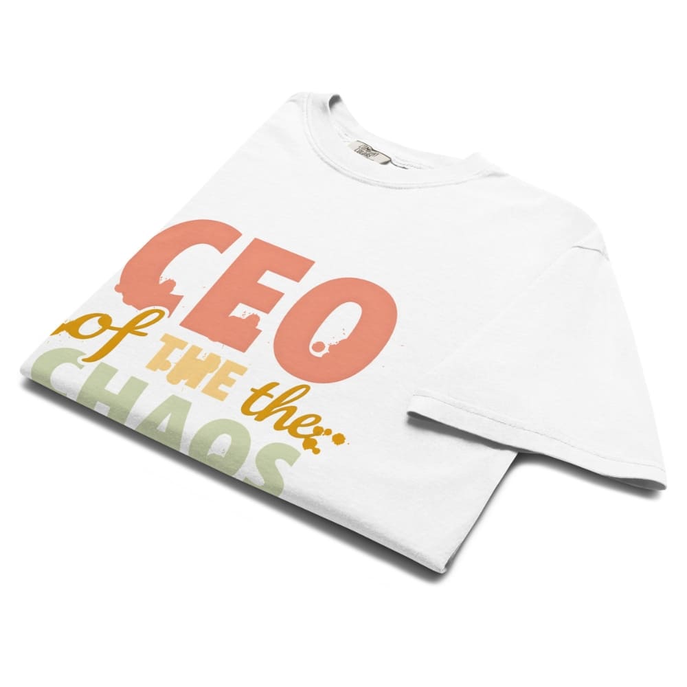 CEO of the Chaos” printed on a heavyweight cotton t-shirt in soft pastel ink, laid flat with a minimal lifestyle background.