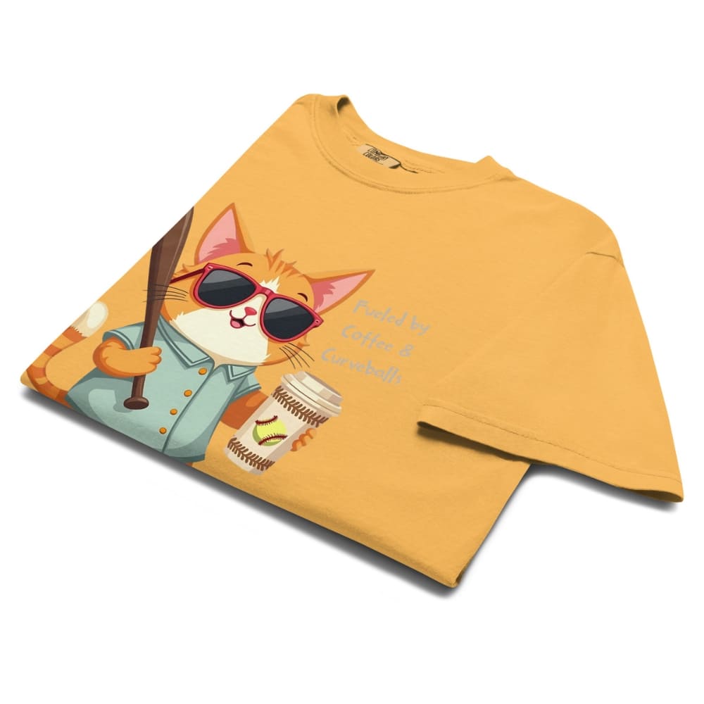 Cool cat with sunglasses holding a softball bat and coffee cup, beside text “Fueled by Coffee & Curveballs” – printed on soft heavyweight t-shirt for sporty moms