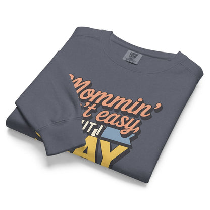 “Mommin' Ain’t Easy But I Slay” retro-style DTG printed design in peach, blue, and yellow on vintage garment-dyed fleece sweatshirt