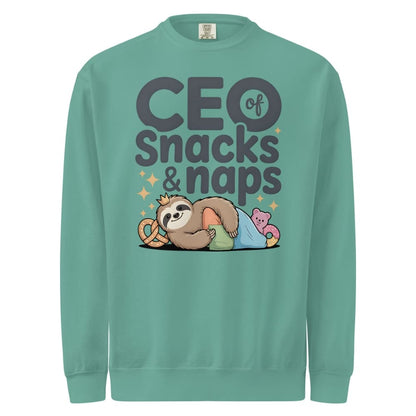 "CEO of Snacks & Naps" printed sweatshirt featuring a sloth in a crown surrounded by pretzels and plushies on vintage-washed cotton fleece