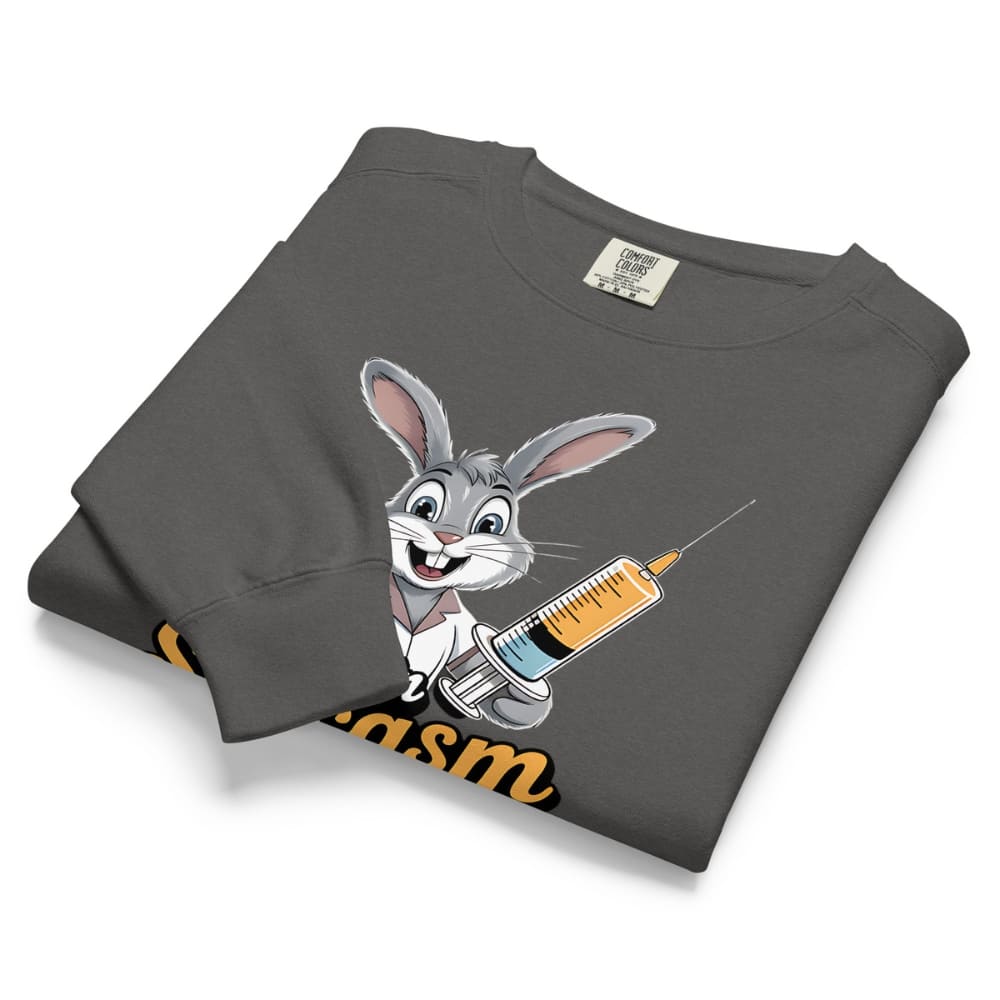 Folded gray sweatshirt with cartoon character holding a syringe on a white background