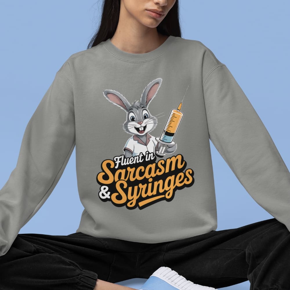 Person wearing a gray sweatshirt with a cartoon character and text on a blue background