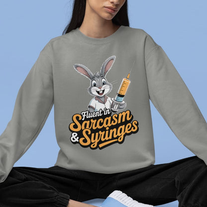 Person wearing a gray sweatshirt with a cartoon character and text on a blue background