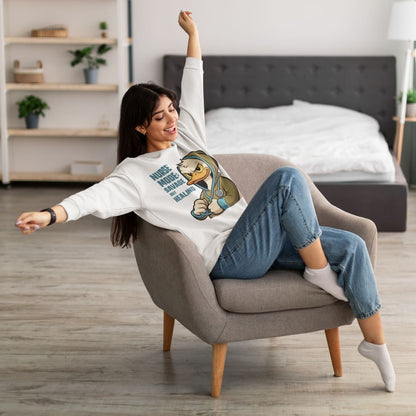 Woman sitting on a chair wearing a sweatshirt with a graphic design in a bedroom.