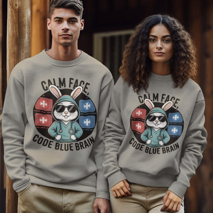 Two people wearing gray sweatshirts with a graphic design of a rabbit character and text.