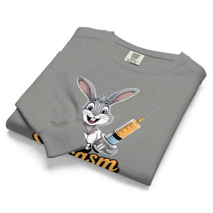 Folded gray sweatshirt with cartoon character holding a syringe on a white background