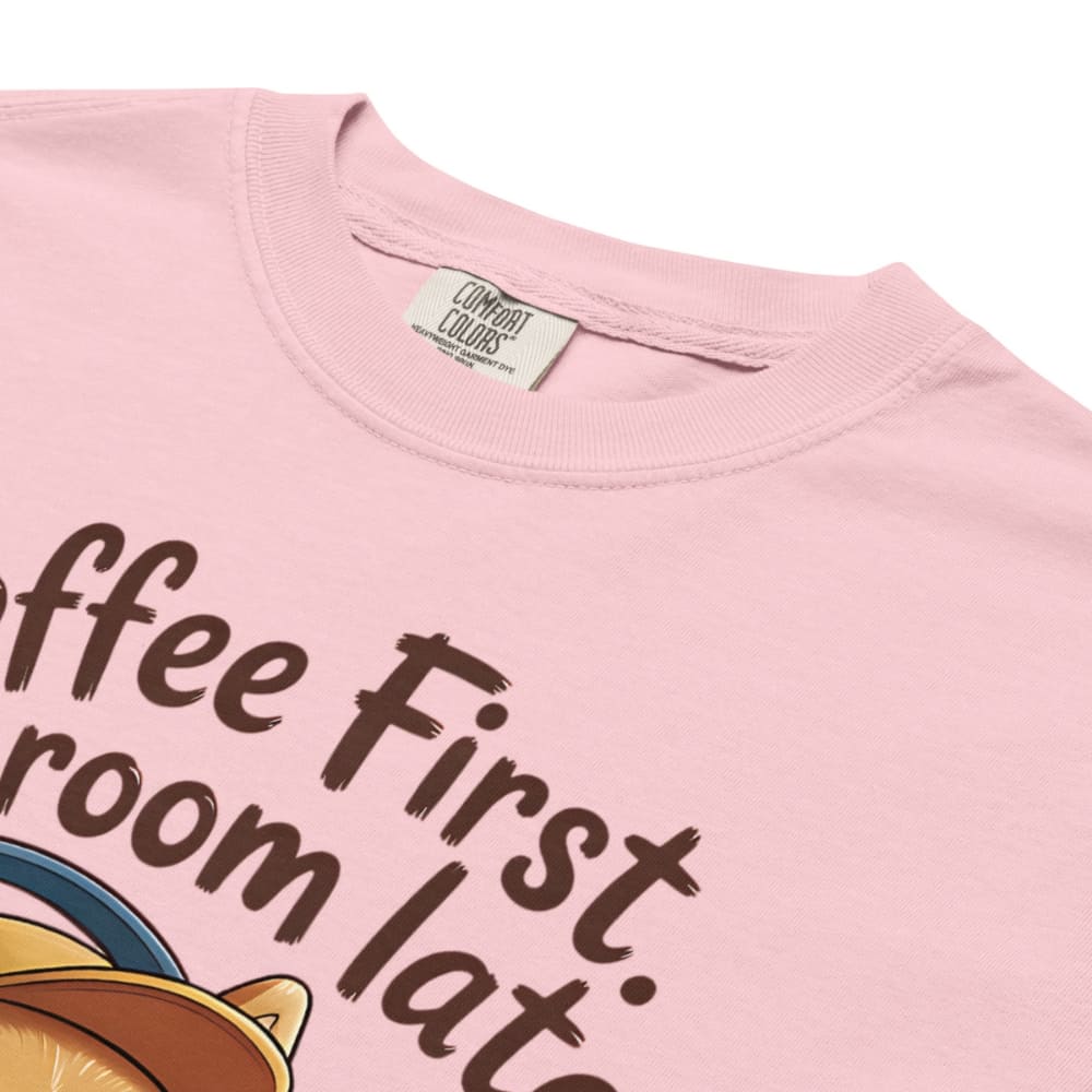 Pink t-shirt with text and a coffee cup graphic, brand label visible.