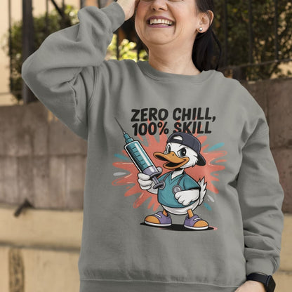Person wearing a gray sweatshirt with a cartoon duck design and text outdoors.