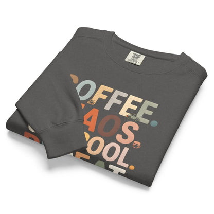 Folded dark gray sweatshirt with colorful text design on a white background