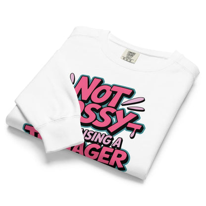 White t-shirt with pink and black text design on a white background