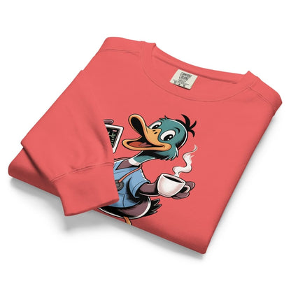Folded red sweatshirt with cartoon duck design holding a coffee cup on a white background