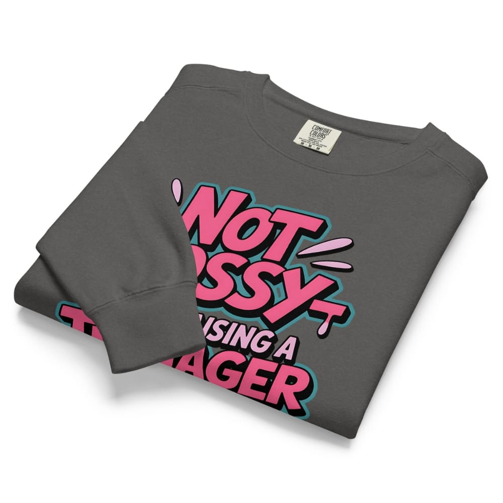 Folded gray sweatshirt with pink and black text on a white background