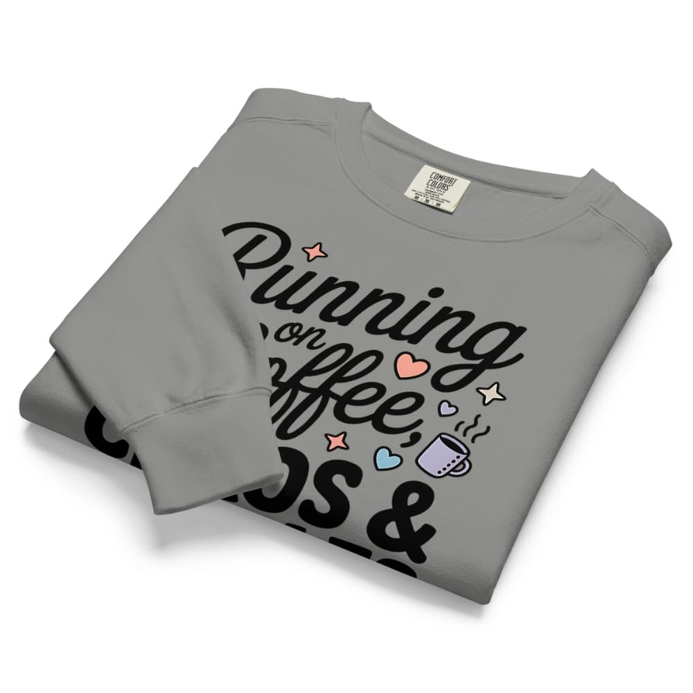 Folded gray sweatshirt with text and graphics on a white background