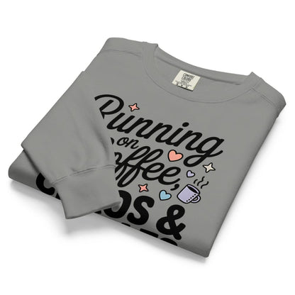 Folded gray sweatshirt with text and graphics on a white background