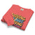 Folded pink sweatshirt with colorful text design on a white background