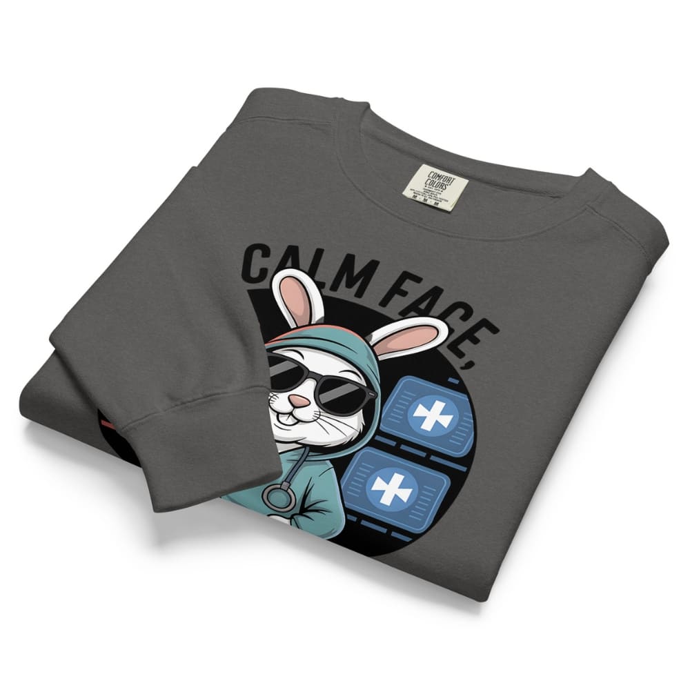 Folded gray sweatshirt with a graphic design of a rabbit and text on a white background