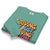 Folded teal sweatshirt with colorful text design on a white background